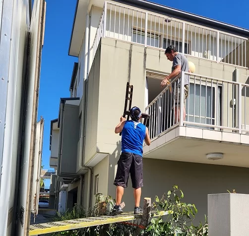 Furniture relocation over a balcony